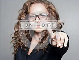 Woman pushing the Ã¢â¬ÅoffÃ¢â¬Â button
